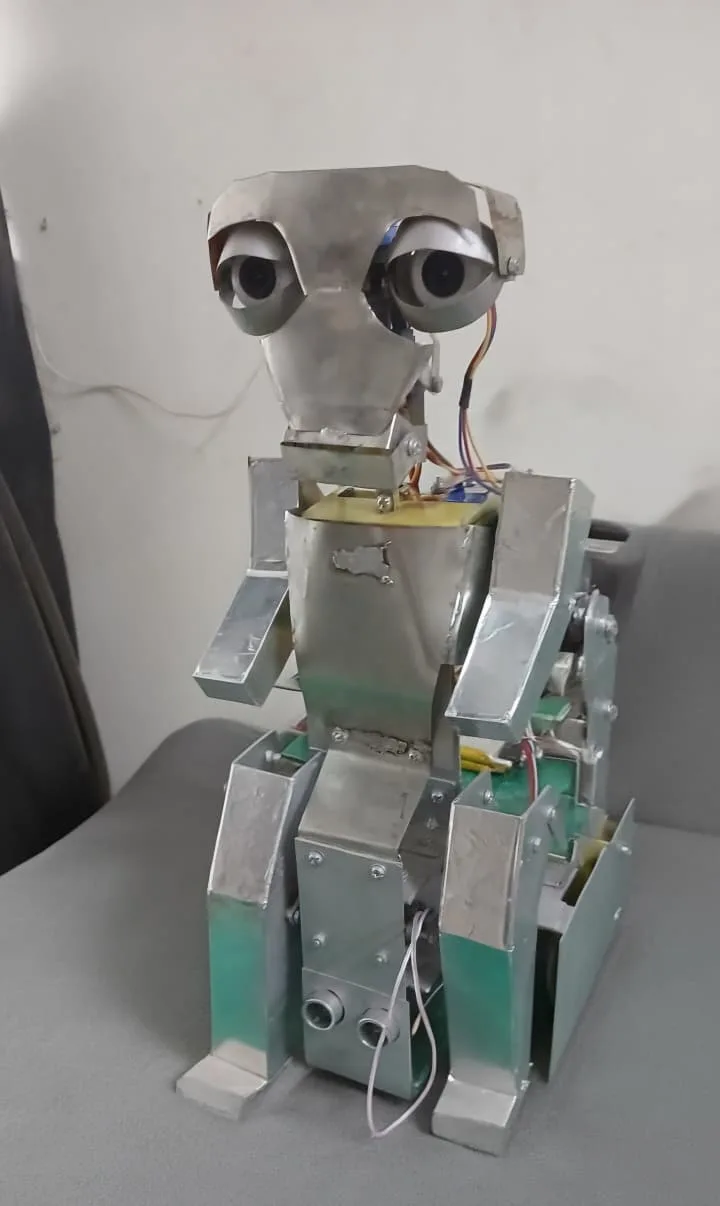 The full Brutus build sitting on a couch: head, torso and arm assemblies